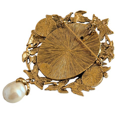 Vintage KJL for Avon gold tone cameo brooch pendant with resin cameo, faux pearls, clear rhinestones, and ornate detailing.