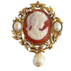 Vintage KJL for Avon gold tone cameo brooch pendant with resin cameo, faux pearls, clear rhinestones, and ornate detailing.