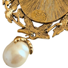 Vintage KJL for Avon gold tone cameo brooch pendant with resin cameo, faux pearls, clear rhinestones, and ornate detailing.