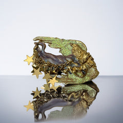 Vintage Kirk’s Folly guardian angel brooch with purple and cream enamel, iridescent sparkles, gold tone finish, signed on back, featuring angel holding baby with dangling star charms, excellent condition
