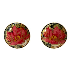 Hand-painted floral brooch and screw-back earrings set in lacquered wood with gold-tone trim, featuring red and pink flowers on a black background, signed by the artist.