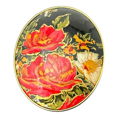 Hand-painted floral brooch and screw-back earrings set in lacquered wood with gold-tone trim, featuring red and pink flowers on a black background, signed by the artist.