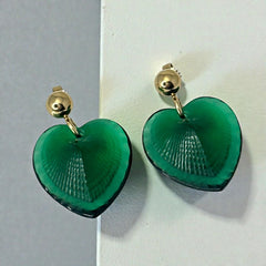 Vintage Lalique Telline earrings with translucent green satin glass hearts, ribbed textured fronts, polished backs etched with the Lalique signature, and gold plated posts, in excellent condition.