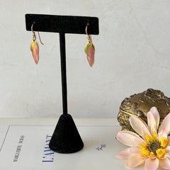 Vintage Laurel Burch “Barbee’s Blossom” earrings with pink and green enamel petal-shaped design and gold‑tone hooks.