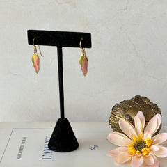 Vintage Laurel Burch “Barbee’s Blossom” earrings with pink and green enamel petal-shaped design and gold‑tone hooks.