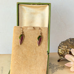 Vintage Laurel Burch “Barbee’s Blossom” earrings with pink and green enamel petal-shaped design and gold‑tone hooks.