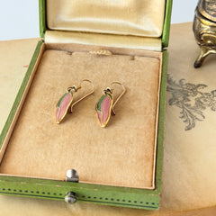 Vintage Laurel Burch “Barbee’s Blossom” earrings with pink and green enamel petal-shaped design and gold‑tone hooks.
