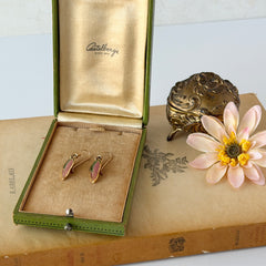 Vintage Laurel Burch “Barbee’s Blossom” earrings with pink and green enamel petal-shaped design and gold‑tone hooks.