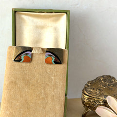 Vintage Laurel Burch “Tori Mon Bird of the Nile” square post earrings with orange, black, purple and green enamel bird motif on gold‑tone metal.