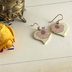 Vintage Laurel Burch Hibiscus Heart earrings with pink and white enamel flowers on gold‑tone heart dangles.