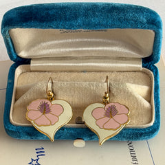 Vintage Laurel Burch Hibiscus Heart earrings with pink and white enamel flowers on gold‑tone heart dangles.