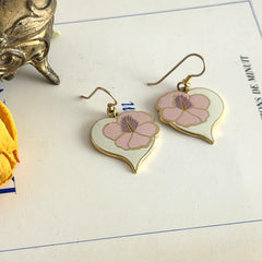 Vintage Laurel Burch Hibiscus Heart earrings with pink and white enamel flowers on gold‑tone heart dangles.