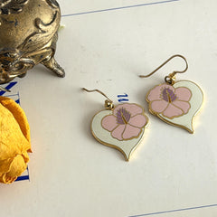 Vintage Laurel Burch Hibiscus Heart earrings with pink and white enamel flowers on gold‑tone heart dangles.