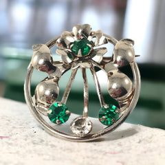 Vintage 1940s Leo Glass sterling silver floral brooch with emerald and clear rhinestones