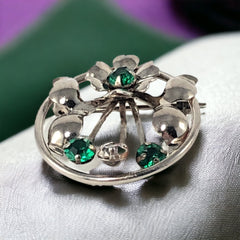 Vintage 1940s Leo Glass sterling silver floral brooch with emerald and clear rhinestones
