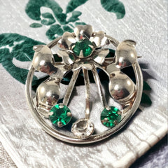 Vintage 1940s Leo Glass sterling silver floral brooch with emerald and clear rhinestones