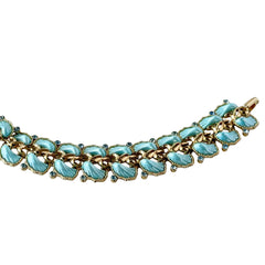 Vintage Leru light blue thermoset Lucite shell bracelet with gold‑tone links and blue rhinestones, signed Leru ©.