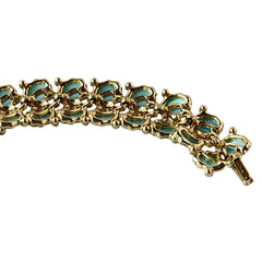 Vintage Leru light blue thermoset Lucite shell bracelet with gold‑tone links and blue rhinestones, signed Leru ©.
