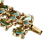 Vintage Leru light blue thermoset Lucite shell bracelet with gold‑tone links and blue rhinestones, signed Leru ©.