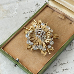 Vintage Lisner gold‑tone sunburst brooch with clear rhinestones, 1960s, signed Lisner ©, excellent condition.