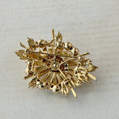 Vintage Lisner gold‑tone sunburst brooch with clear rhinestones, 1960s, signed Lisner ©, excellent condition.