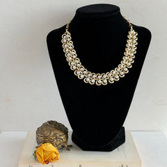 Vintage Lisner necklace with faux pearls and gold‑tone links, shown from various angles to display its mid‑century design, adjustable length, and signed clasp.