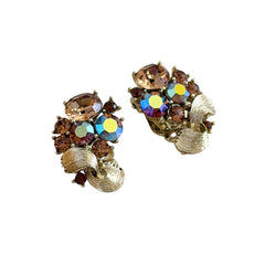 Vintage Lisner light smoked topaz and AB topaz gold‑tone floral clip‑on earrings from the 1950s.
