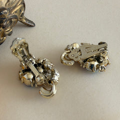 Vintage Lisner light smoked topaz and AB topaz gold‑tone floral clip‑on earrings from the 1950s.