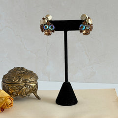 Vintage Lisner light smoked topaz and AB topaz gold‑tone floral clip‑on earrings from the 1950s.