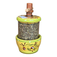 Hand-painted Provence herb mill with green, yellow, and brown olive branch motif on ceramic base, featuring a transparent chamber filled with dried herbs and topped with a wooden handle and cork stoppers.