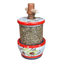 Vintage Provence herb mill with hand-painted olive branch motif in green and black on a cream ceramic base, featuring a ridged interior and terracotta accents.