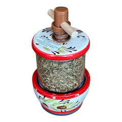 Vintage Provence herb mill with hand-painted olive branch motif in green and black on a cream ceramic base, featuring a ridged interior and terracotta accents.