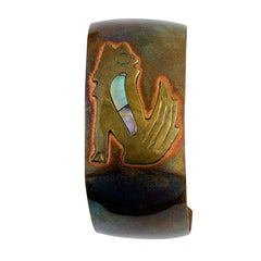 Vintage Southwestern copper and brass cuff bracelet with abalone wolf motif and natural patina, shown from multiple angles.