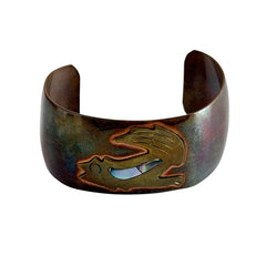 Vintage Southwestern copper and brass cuff bracelet with abalone wolf motif and natural patina, shown from multiple angles.