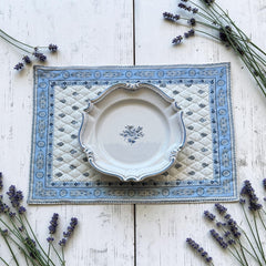 Quilted cotton placemat in light blue and white with Provençal floral and paisley motifs, handcrafted in France by Tissus Toselli.