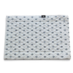 Quilted cotton placemat in light blue and white with Provençal floral and paisley motifs, handcrafted in France by Tissus Toselli.