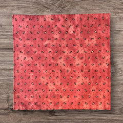 Provence cotton napkins featuring a rust orange background with red and yellow floral designs from Marat d’Avignon Tradition Collection, made of 100% cotton, measuring 18" x 18", with vibrant, fade-resistant prints. Made in France.