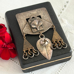 Vintage Marjorie Baer MB SF modernist brooch in textured silver tone and brass with stylized ginkgo leaf and dangling elements, shown from multiple angles to highlight design and condition.