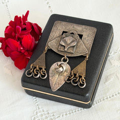 Vintage Marjorie Baer MB SF modernist brooch in textured silver tone and brass with stylized ginkgo leaf and dangling elements, shown from multiple angles to highlight design and condition.