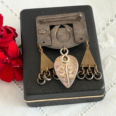 Vintage Marjorie Baer MB SF modernist brooch in textured silver tone and brass with stylized ginkgo leaf and dangling elements, shown from multiple angles to highlight design and condition.