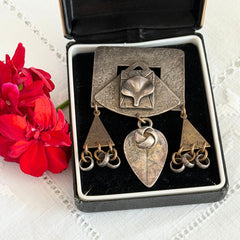Vintage Marjorie Baer MB SF modernist brooch in textured silver tone and brass with stylized ginkgo leaf and dangling elements, shown from multiple angles to highlight design and condition.