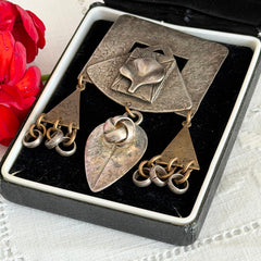 Vintage Marjorie Baer MB SF modernist brooch in textured silver tone and brass with stylized ginkgo leaf and dangling elements, shown from multiple angles to highlight design and condition.