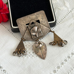 Vintage Marjorie Baer MB SF modernist brooch in textured silver tone and brass with stylized ginkgo leaf and dangling elements, shown from multiple angles to highlight design and condition.