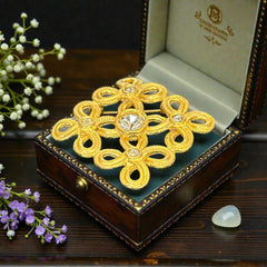 Vintage matte gold tone brooch with textured open loops and clear rhinestones, shown from different angles to highlight its square or diamond shape and detailed craftsmanship