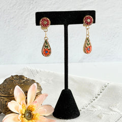 Vintage Italian micro mosaic dangle clip‑on earrings with red, orange, green, and white floral glass tesserae set in gold‑tone metal.