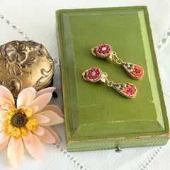 Vintage Italian micro mosaic dangle clip‑on earrings with red, orange, green, and white floral glass tesserae set in gold‑tone metal.