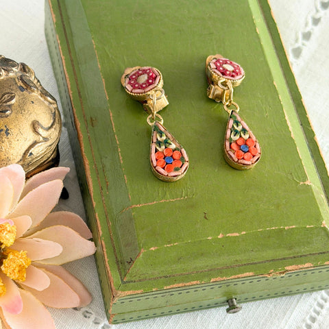 Vintage Italian micro mosaic dangle clip‑on earrings with red, orange, green, and white floral glass tesserae set in gold‑tone metal.