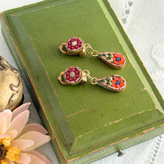 Vintage Italian micro mosaic dangle clip‑on earrings with red, orange, green, and white floral glass tesserae set in gold‑tone metal.