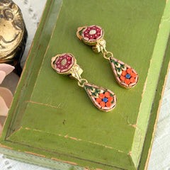 Vintage Italian micro mosaic dangle clip‑on earrings with red, orange, green, and white floral glass tesserae set in gold‑tone metal.