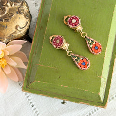 Vintage Italian micro mosaic dangle clip‑on earrings with red, orange, green, and white floral glass tesserae set in gold‑tone metal.